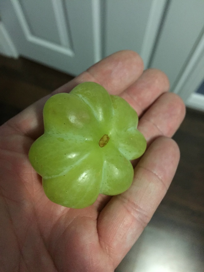 Eight grapes fused into one.