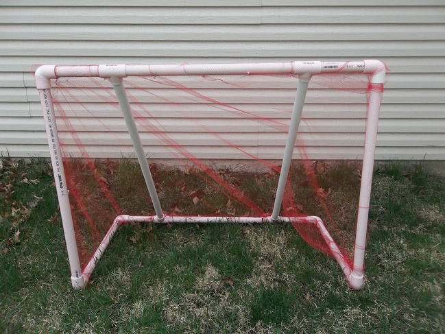 You can make your own goal post out of PVC pipes and a net.