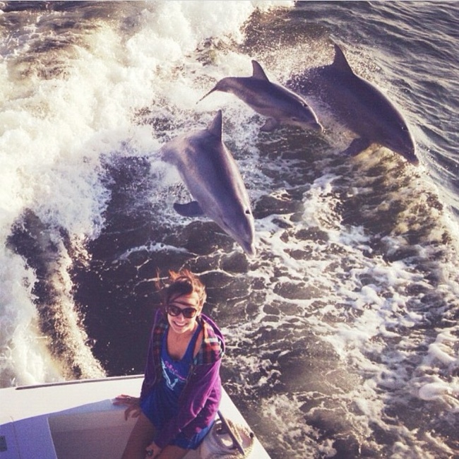 “I wanted to take a photo on the edge of the boat and suddenly dolphins jumped out of the water. It was the perfect moment.”