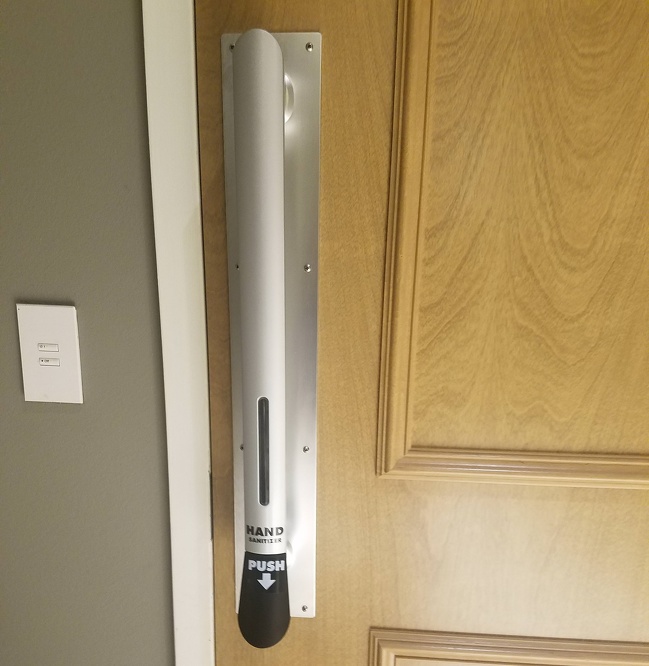 This door knob has a built-in hand sanitizer dispenser.
