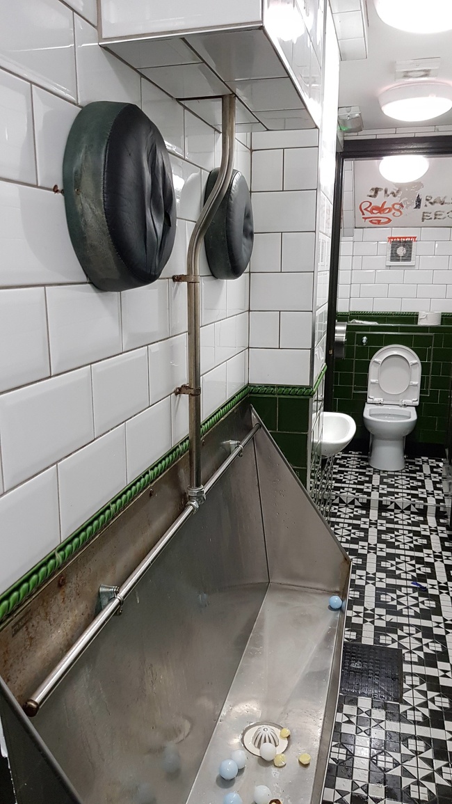 This bar toilet has cushions for tipsy customers.