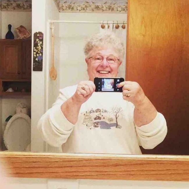 Grandma takes her first selfie.