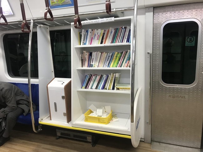 One of the cars in the Seoul subway has a mini-library.