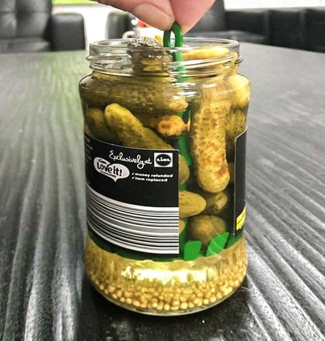 There’s a tiny lifting tool in this pickle jar.