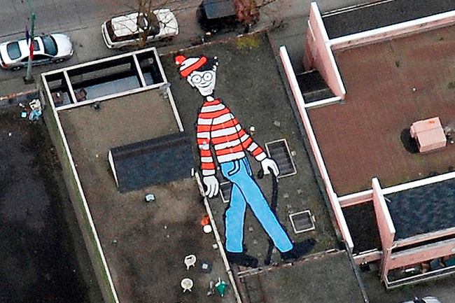 A Canadian student, Melanie Coles has installed a 55 ft painting of Waldo on a Vancouver rooftop.