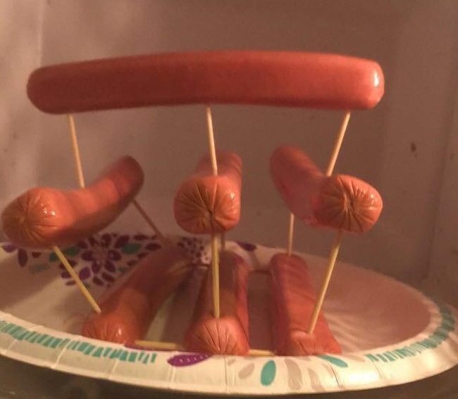 To warm up all the hot dogs in the microwave at once, use toothpicks and a little imagination.