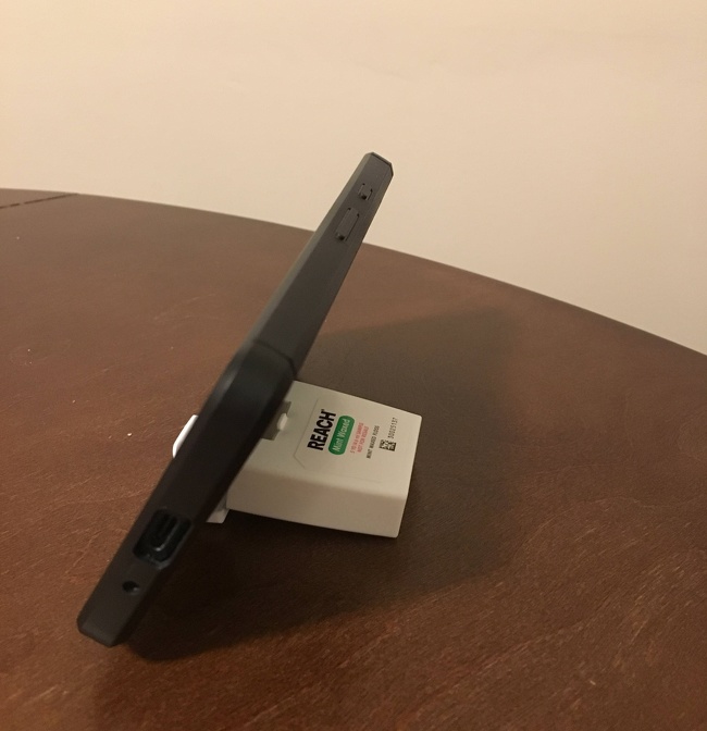 Instead of a stand for your phone, you can use a box of dental floss.