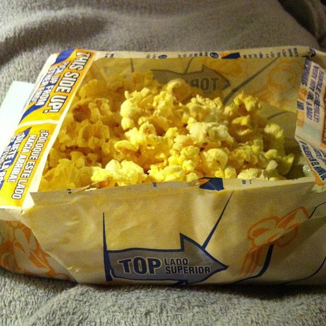 use the original package to heat up popcorn and avoid another dirty plate by cutting out the center.