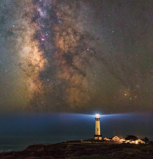 The Milky Way above a lighthouse