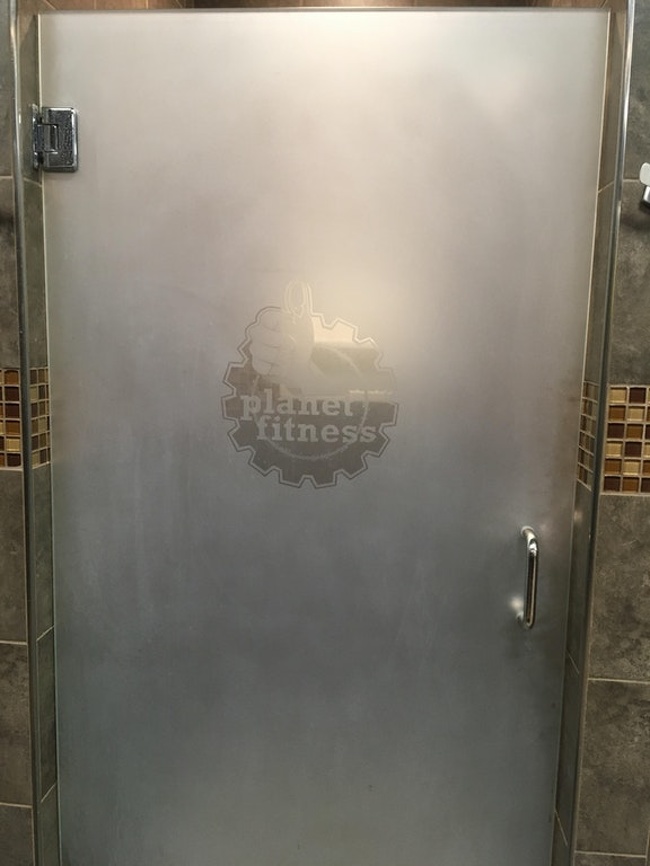 The showers in the women’s locker room have the logo of the gym right at breast level.