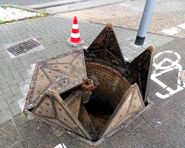 The way that this sewer grate opens will remind you of the entrance to a dragon’s dungeon.
