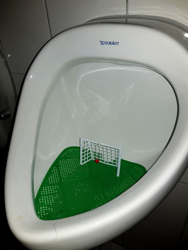 This urinal in a German bar had a soccer goal and movable ball inside of it.