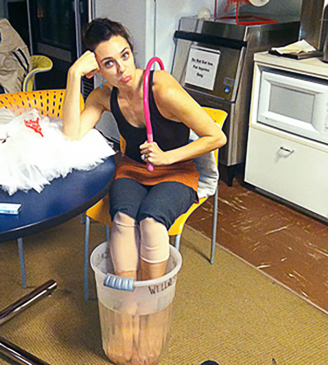 A ballerina is resting after an injury.