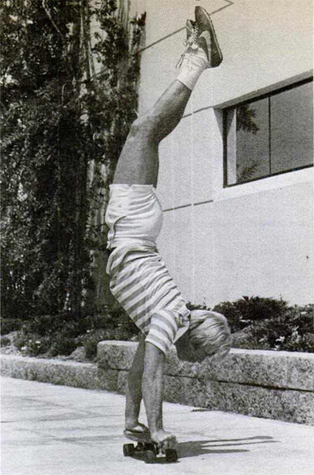 Chuck Norris, kicking a skateboard in the face with his hands.
