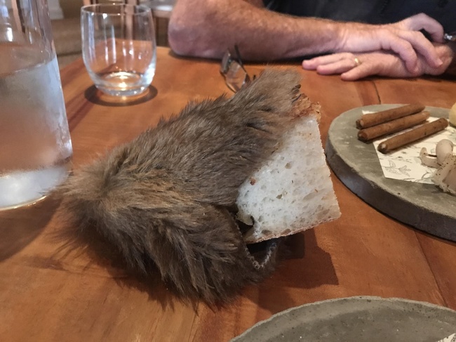 This restaurant serves bread in the most creative way — in a fur bag.
