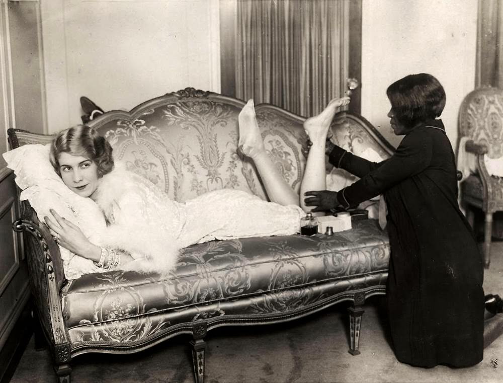Eleanor Ambrose, highest paid dancer in the U.S. at this time, gets a massage by her maid in 1926.