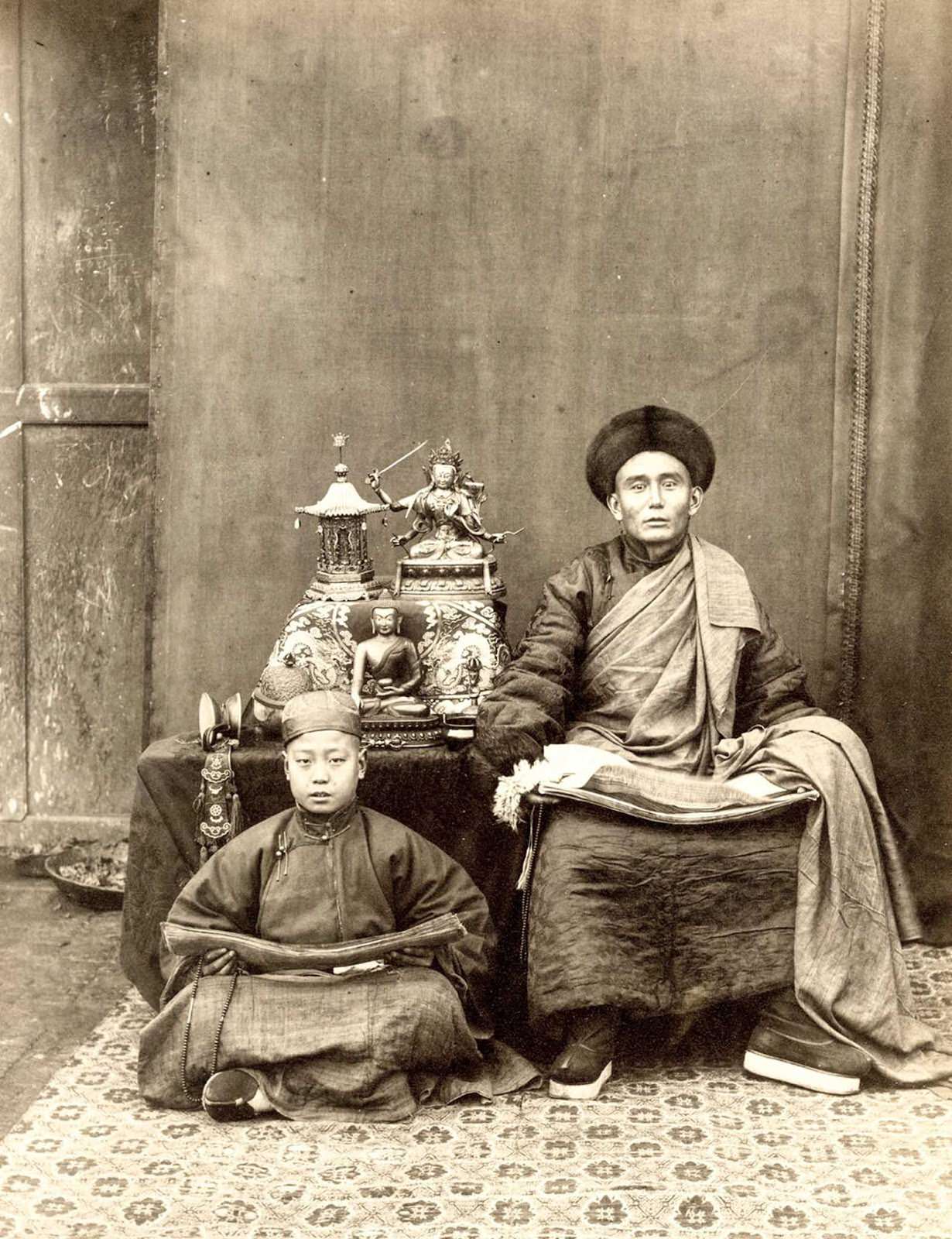 A Buddhist monk and his pupil in Tibet in 1889.