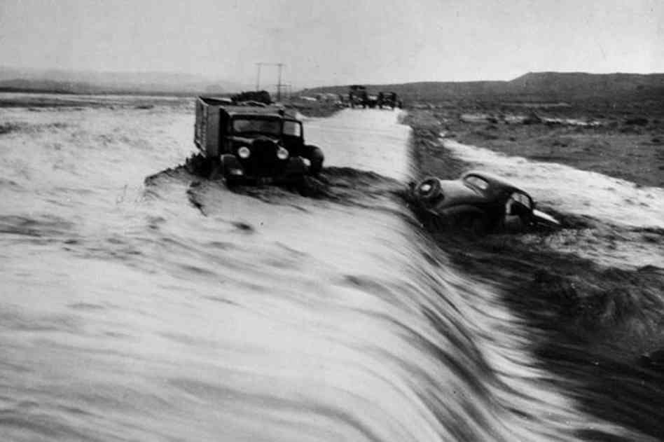 A couple vehicles attempted to cross a flooded road with disastrous results during the great Mississippi River Flood in Tennessee, US in 1927. It is unknown what happened to the drivers and passengers.