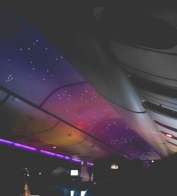 Ceiling in an airplane that looks like a beautiful nights sky