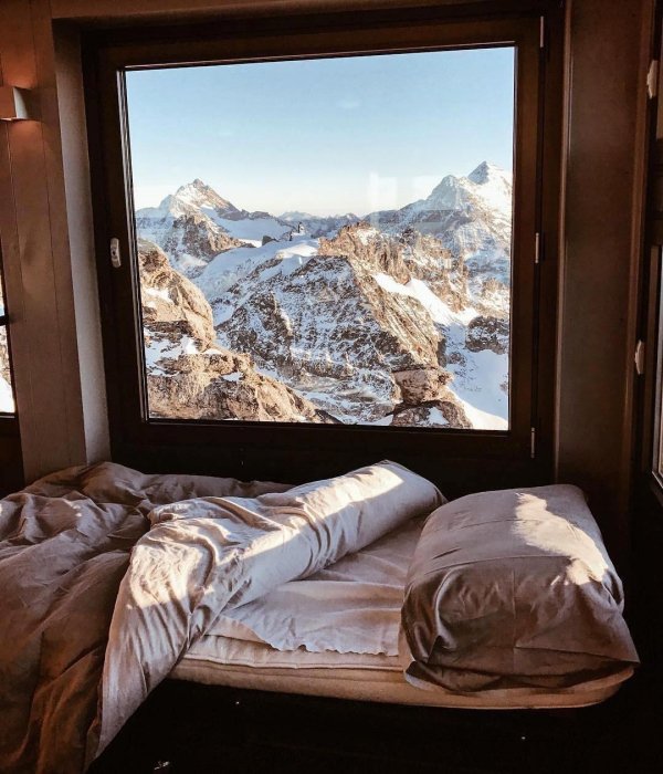 Beautiful view of some mountains from a bed