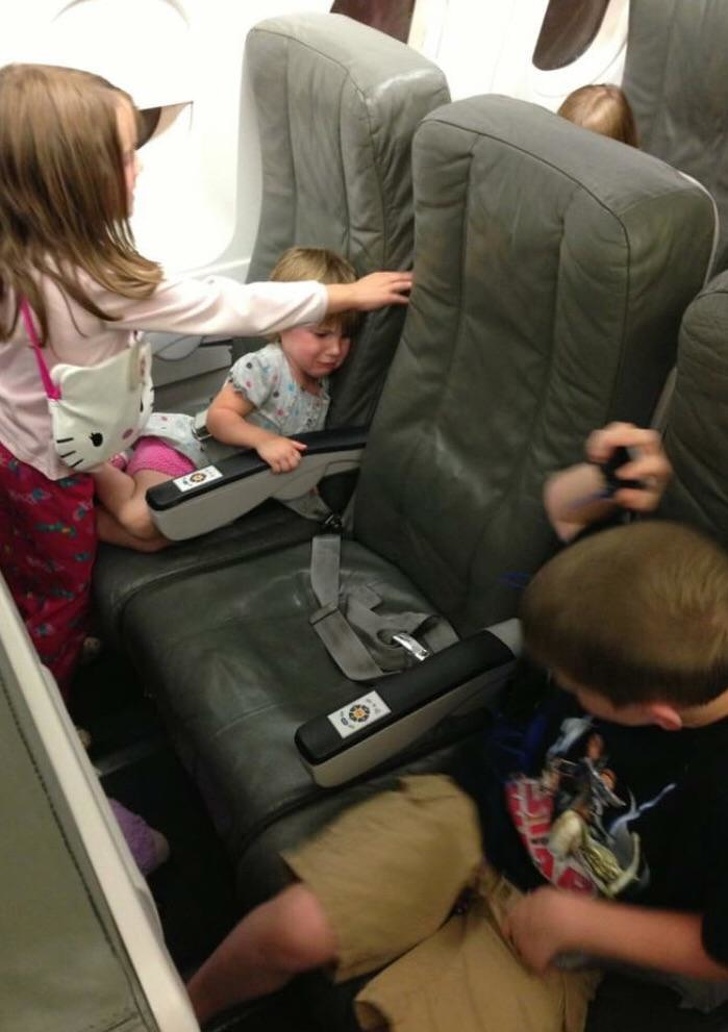 “One long flight with kids I don’t know. That’s my seat in the middle.”