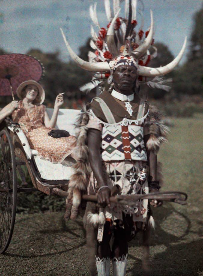 A Zulu tribesman pulls his employer in South Africa in 1932. The picture was taken in color.