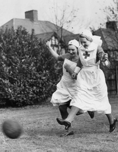 Red Cross nurses playing soccer (football) in England in 1939.