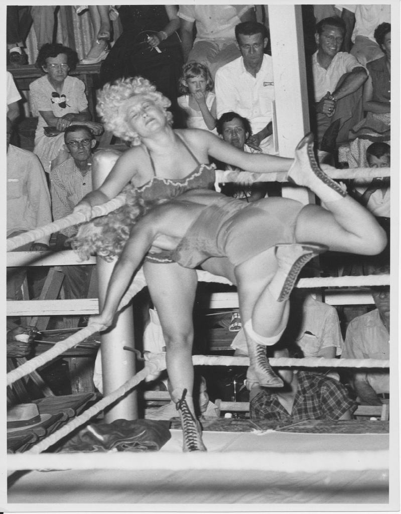 The moment of impact during a womens wrestling match in the US in 1954.