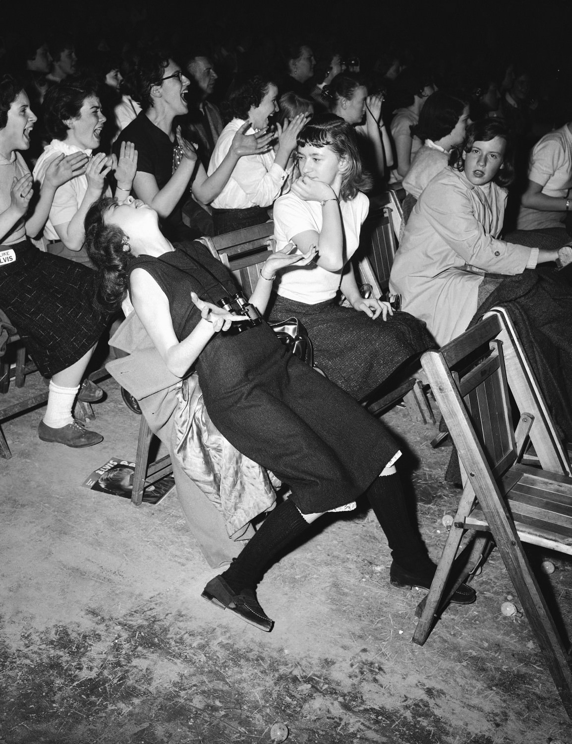 Young ladies lose their mind when Elvis Presley takes the stage in Philadelphia, US in 1957.