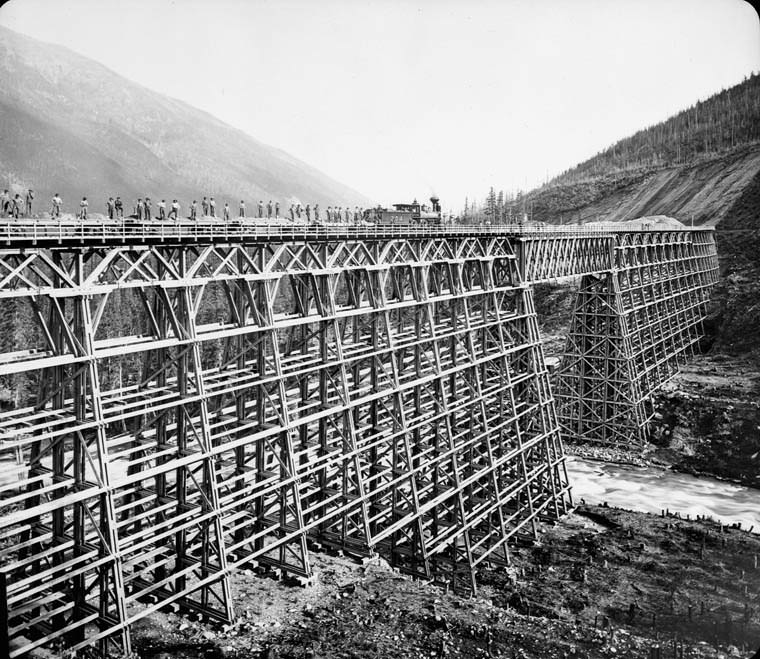 A train from the Canadian Pacific Railway goes over a the newly built bridge over Mountain Creek in British Columbia, Canada in 1890.