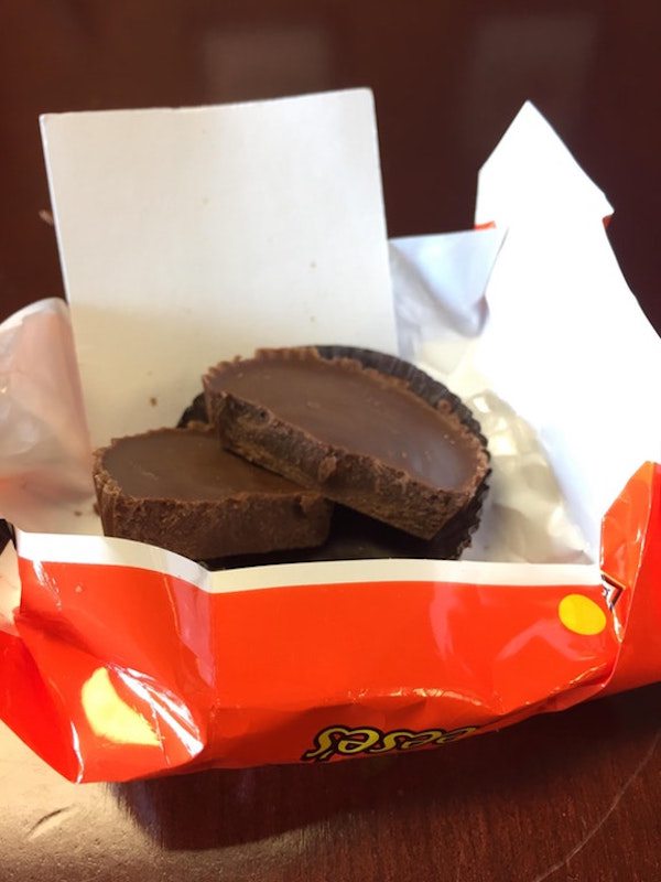 According to an interview with Insider, he was at work, munching on a bag of room temperature Reese’s when he noticed that something wasn’t quite right. The cup should have been squishy, but instead was solid. Breaking it open, he found a discrepancy in his candy – no PB filling.