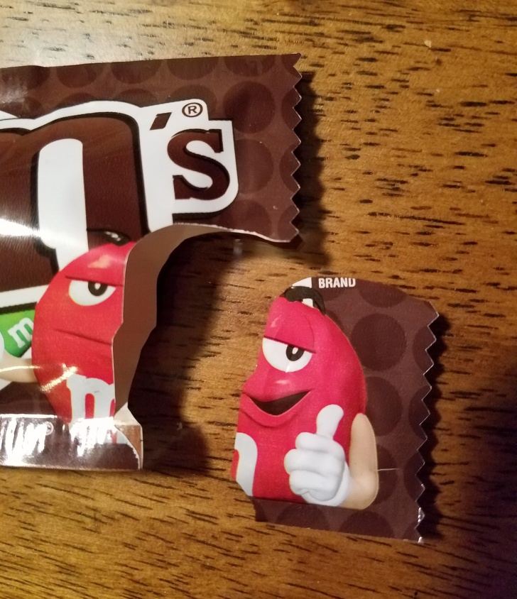 Because of the rip placement, the M&M on the bag has 2 emotions.
