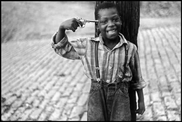 A kid plays with a toy gun in Pittsburgh, US in 1950.