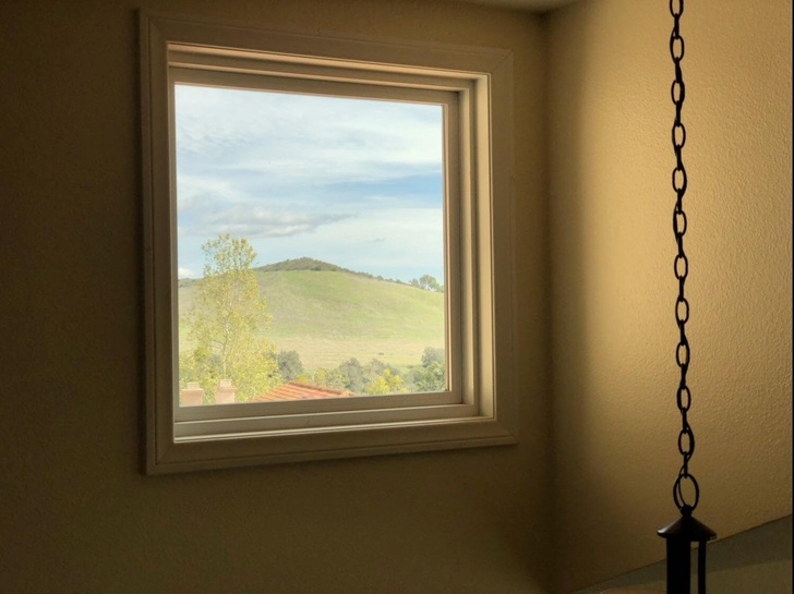 This window looks more like a picture hanging on the wall.