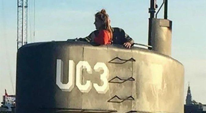 Journalist Kim Wall boards the submarine of Peter Madsen. Madsen would later kill and dismember Wall on board the submarine. Wall was writing a story about the submarine Madsen had built. During a journey together, Madsen murdered Wall, dismembered her, and sank her body parts at sea before being rescued from his sinking sub, which authorities believe he purposely sank.