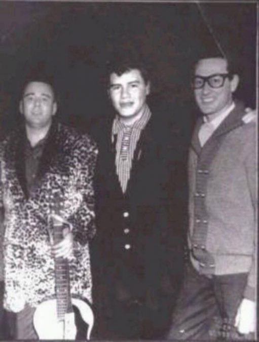 Buddy Holly, J.P. Richardson, and Ritchie Valens pose for a photo before boarding a plane that would crash into a field in Iowa.  The musicians were traveling together for a tour and chartered the plane to get from Clear Lake, Iowa to Moorhead, Minnesota. The plane hit bad weather and went down, killing the three musicians and the pilot, Roger Peterson. The event became known as “The Day the Music Died.”