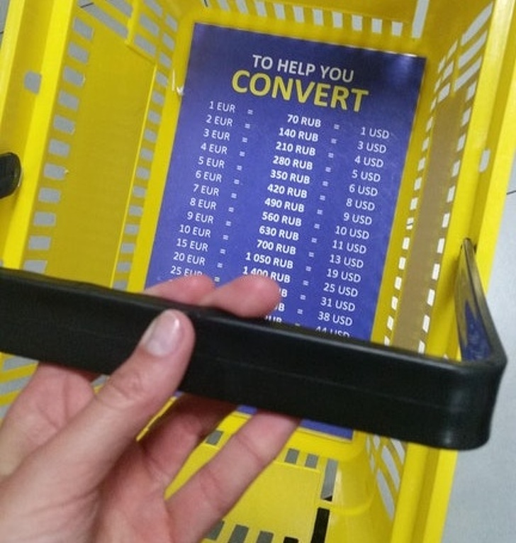 This souvenir shop in St. Petersburg has currency conversion tables on the bottom of their shopping baskets.