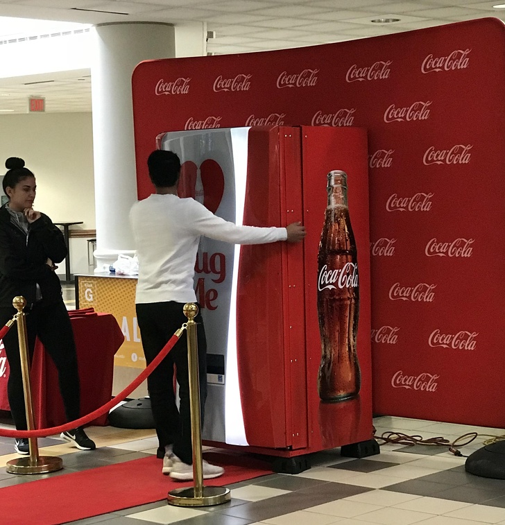 A coke machine that accepts hugs as payment