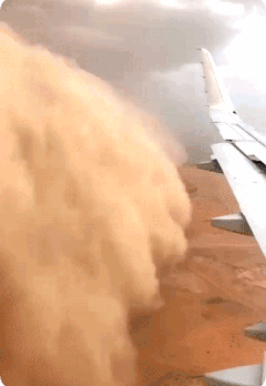A sandstorm is trying to catch a plane.