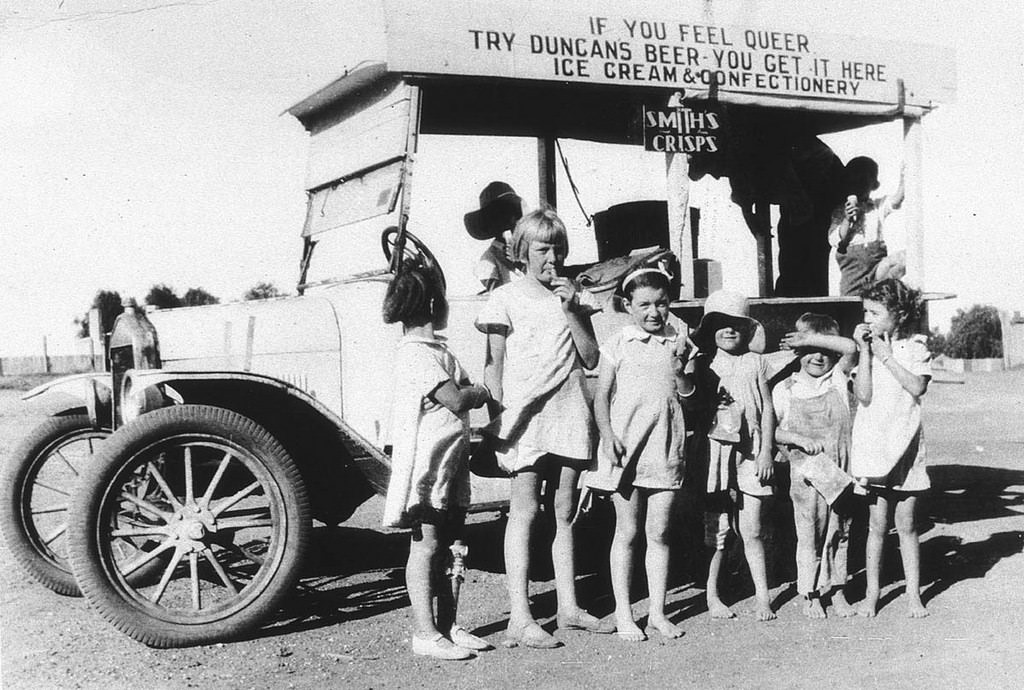 Children eat ice cream in New South Whales, Australia in 1933. The sign makes this picture.