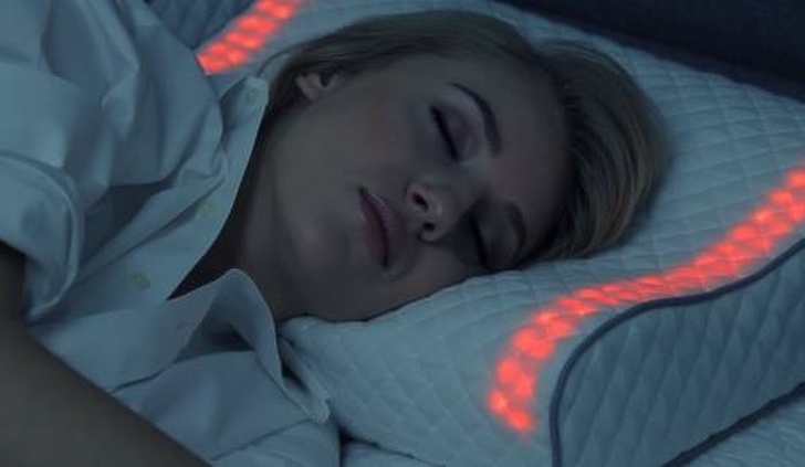 A pillow that wakes you up with light and nature sounds