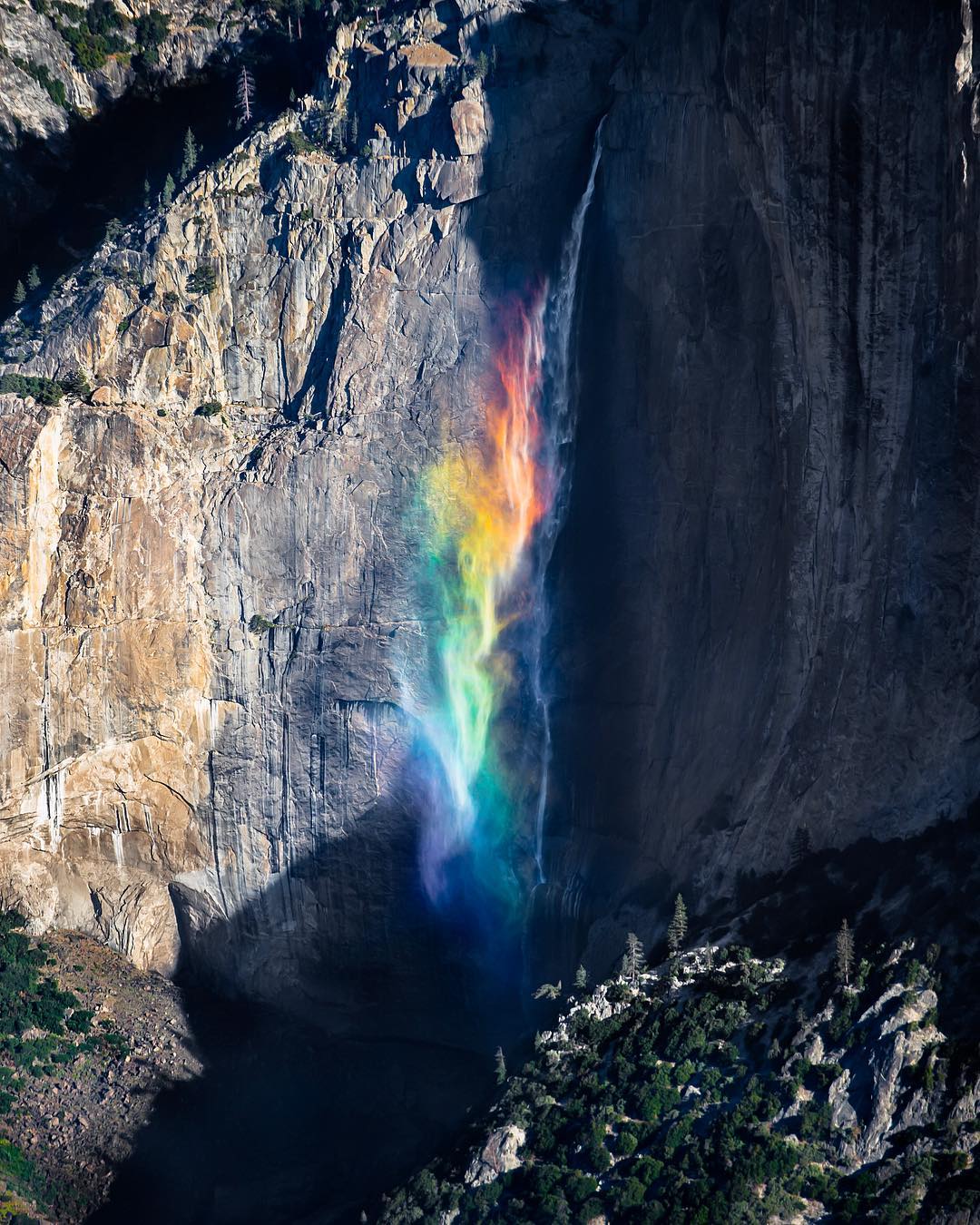 Waterfall splashes created a rainbow.