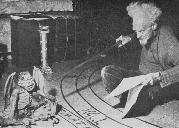 Gerald Gardner practicing a Wiccan ritual using a mummified monkey that had been altered in London, England in 1952.