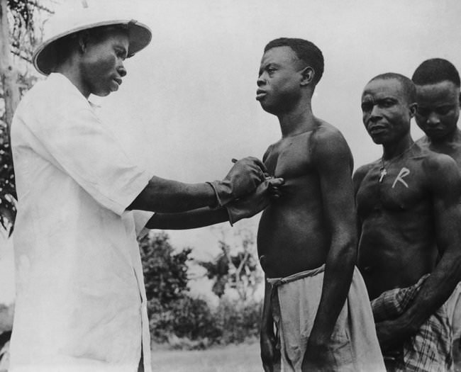 Men get vaccinated against leprosy in Nigeria in 1953.