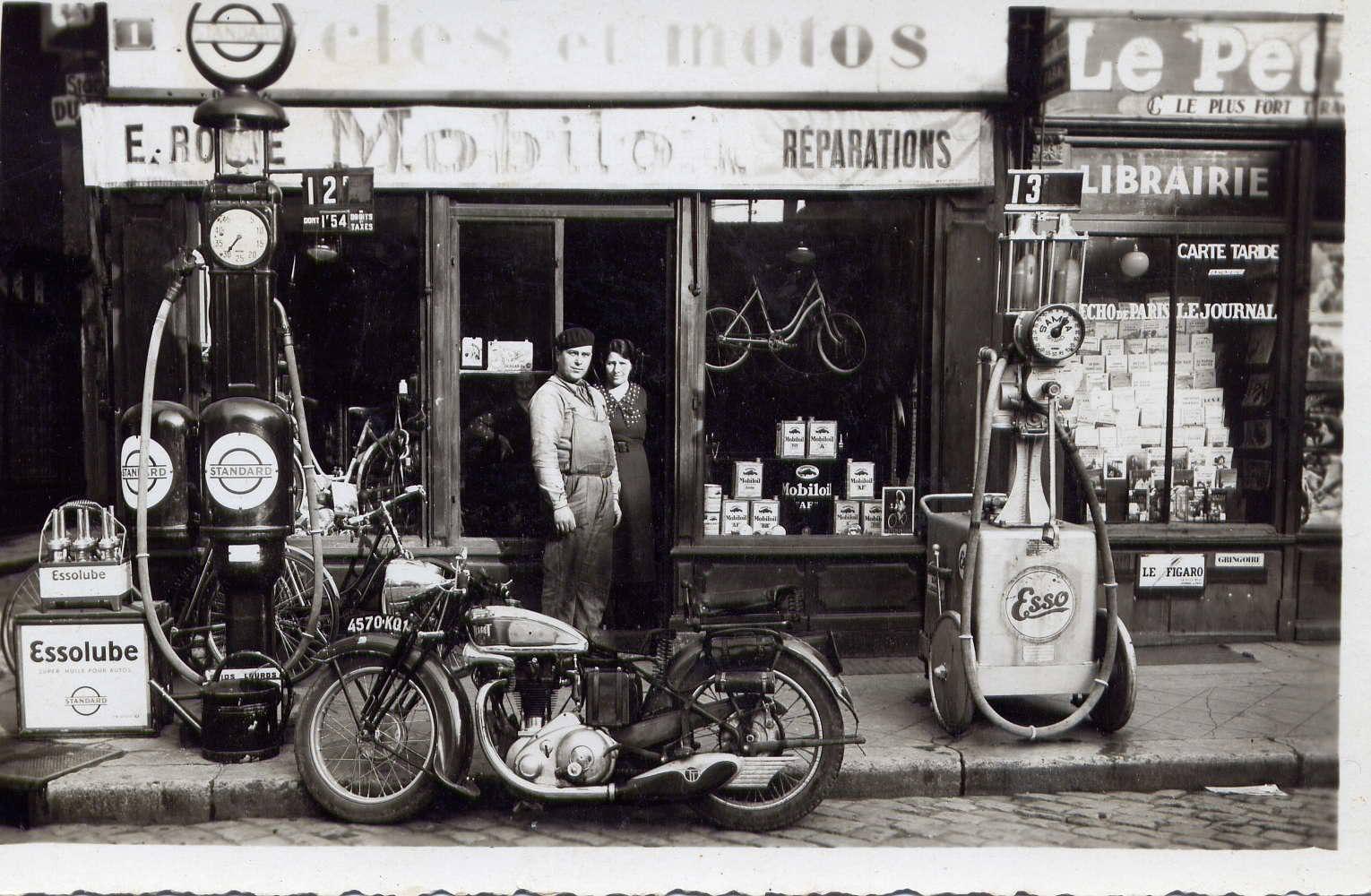A small general store with gas pumps out front in Paris, France in 1930.
