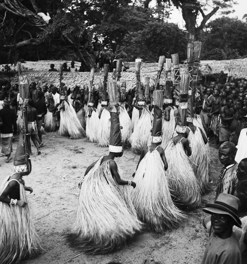 Masqueraders perform a ritual in Nigeria in 1933.