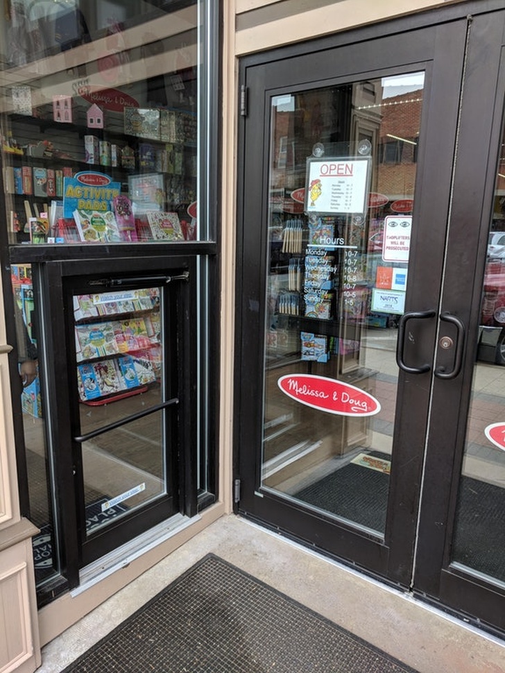 This store that sells children’s items has a tiny door for kids to walk through.