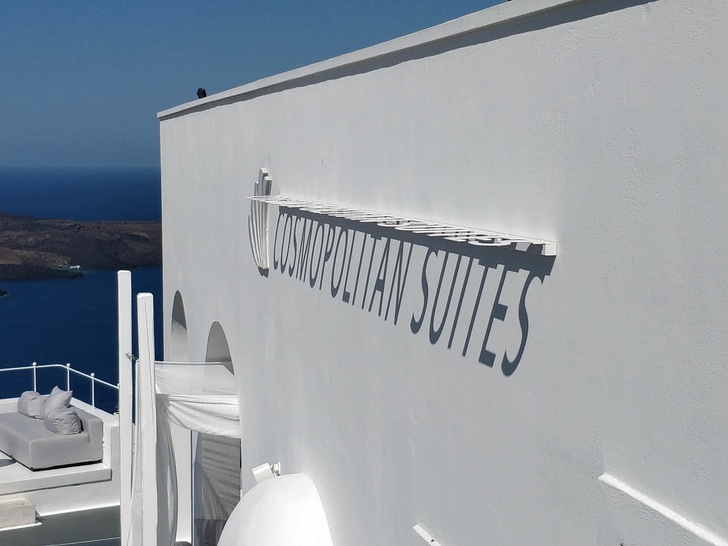 This hotel in Santorini has its name spelled out in shadows.