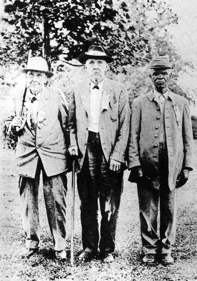 3 Former Confederate soldiers pose for a picture in Tennessee, US in 1920. Their names are Buchanan, W. L. Drake, and Uncle Lewis Nelson.
