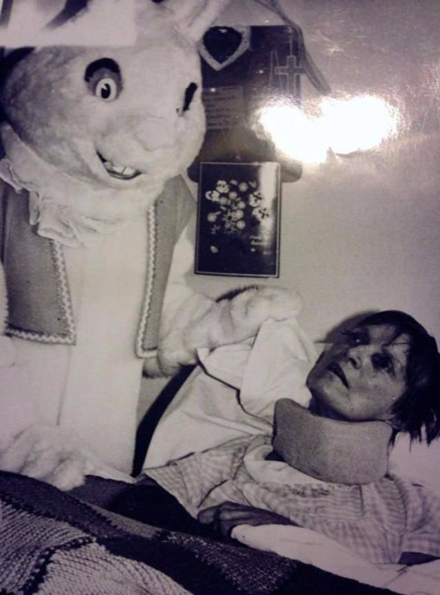 A man dressed as the Easter Bunny visits a sick woman in a hospital in the US in 1951.
